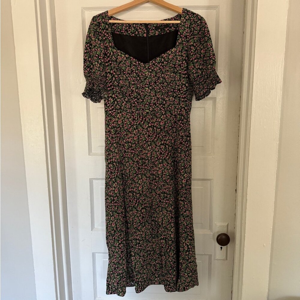 Black dress with puffed sleeves and floral prints